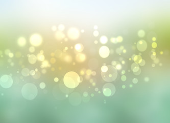 Abstract yellow light and green summer bokeh background.