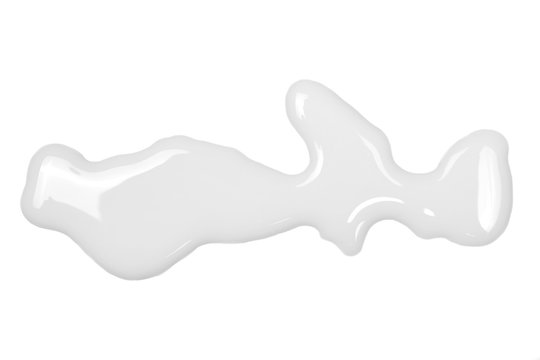 Spilled milk puddle isolated on white background and texture, top view