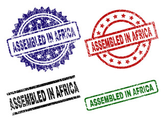 ASSEMBLED IN AFRICA seal prints with damaged texture. Black, green,red,blue vector rubber prints of ASSEMBLED IN AFRICA caption with grunge texture. Rubber seals with circle, rectangle,