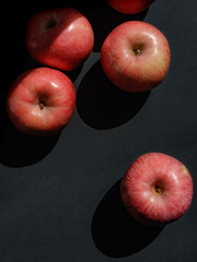Rope apples on a black backdrop, top view