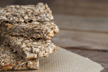Healthy snack. Fitness. Dietary food. Cereal granola bars with nuts, honey and oat meal. Isolated. Copy space