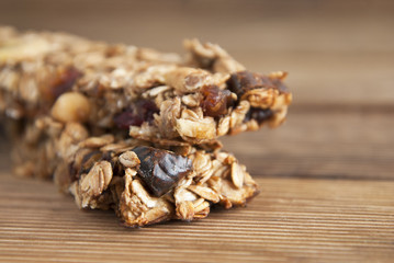 Healthy snack. Fitness. Dietary food. Cereal granola bars with nuts, dried fruits, bannana, honey and oat meal. Isolated.