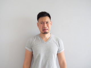 Funny face of man denying something.e donuts and puff pie.