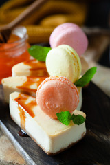  cheesecake with honey decorated with macarons and mint