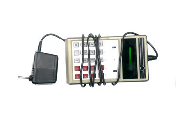 Vintage calculator of the 70s isolated on white background.