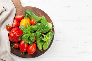 Fresh garden tomatoes and cucumbers
