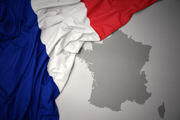 waving colorful national flag and map of france.
