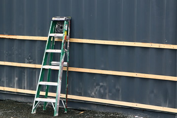 The ladder leaning against the building. © Gene