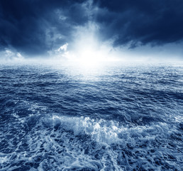Dramatic cloudy sky over the sea. Blue tones.