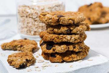 homemade oatmeal cookies with raisins on wooden board