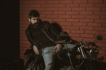 Fototapeta na wymiar man on motorbike. bearded man on relax motorbike. man on motorbike in leather jacket. biker man on motorbike. he needs a little break.