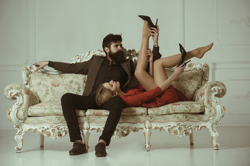 foreplay. foreplay of man and woman. couple foreplay on luxury sofa foreplay and love games of sexy couple - obrazy, fototapety, plakaty