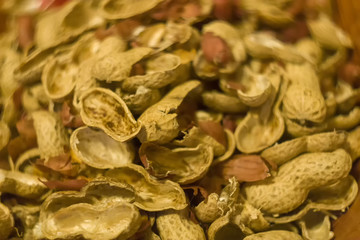 Fototapeta premium Peanuts with shells close up photo.