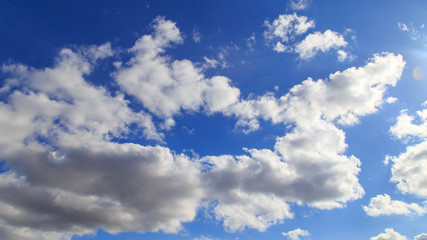 Clouds in the blue sky as an abstract background