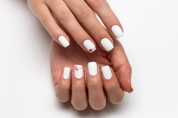 white manicure with a red heart and a cardiogram on short square nails
