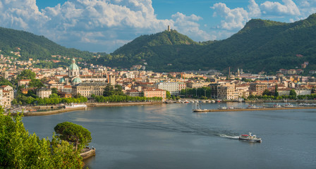 Fototapeta na wymiar Panoramic view of Como city, overlooking the Lake Como, on a sunny summer afternoon. Italy.