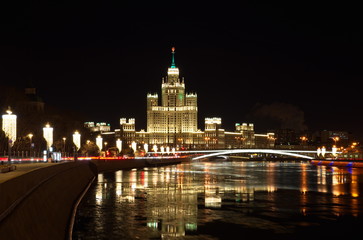 Fototapeta na wymiar Night view of Moskvoretskaya embankment and high-rise building on Kotelnicheskaya embankment, Moscow, Russia