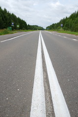 Obraz premium Asphalt road with double solid line