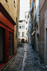 Narrow streets of the ancient city of Pezenas, France.