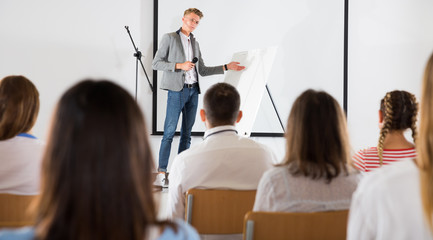 Male coach giving presentation