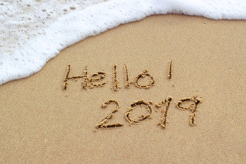 Fototapeta premium New Year 2019 sign in tropical beach sand with turquoise ocean