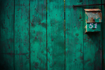 old wooden fence with mailbox