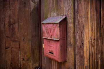 old wooden fence with mailbox