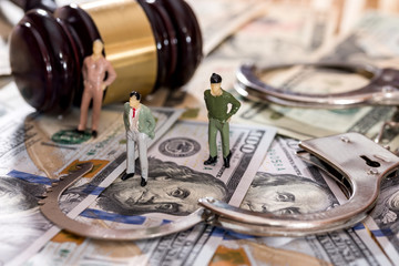 Toy figures with handcuffs and judge's hammer