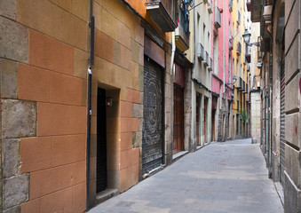 narrow street in Barrio Gotic quarter of Barcelona, Spain
