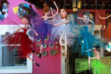 Obraz na płótnie Canvas OLINDA, BRAZIL - JULY, 2018: little colorful ballerina, ballet dancers, sculptures dolls