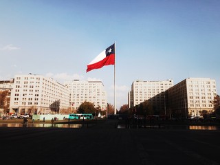 The Chilean flag flies outside the Presidential Palace in Santiago - 217598948