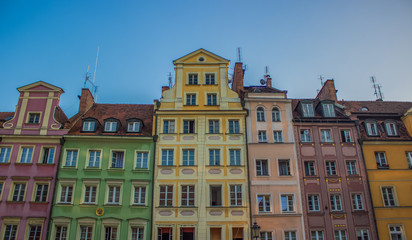 Fototapeta premium soft focus cozy small architecture concept of colorful facades buildings in contrast summer bright day time
