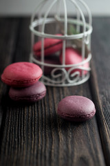 Group of macarons made of strawberries, cream, chocolate and blueberries. Rustic photo.