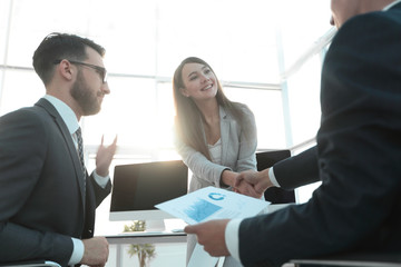 business woman and investor with a handshake.
