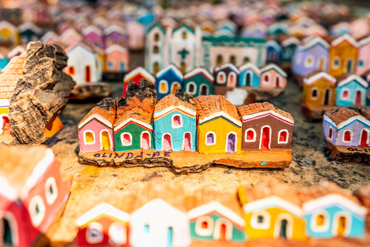 Olinda, Pernambuco, Brazil - JUL, 2018: Little wooden carvings representing the colorful houses and architecture of Olinda