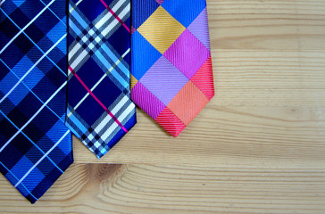 Fashion ties on the background of wooden boards. background and concept.