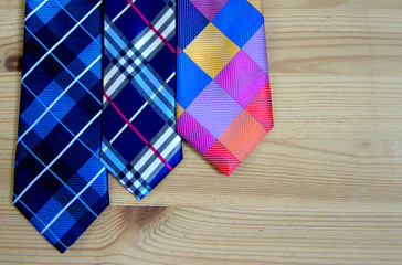 Fashion ties on the background of wooden boards. background and concept.