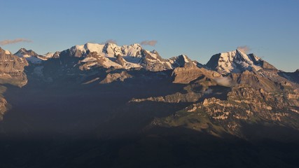 Fototapeta na wymiar High mountains in the Bernese Oberland at sunset. Bluemlisalp Range and Mount Doldenhorn.