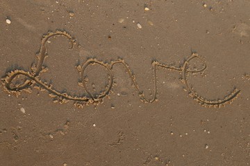 Love written ob sand
