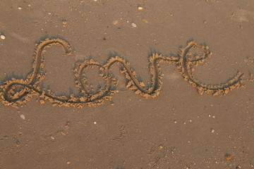 Fototapeta na wymiar love letters on sand