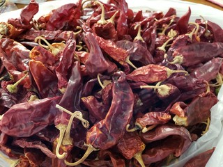 Sun dried red Hatch chile peppers.  These are harvested and placed on the roofs of houses and buildings to dry out naturally. 