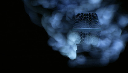 Microphone on dark background.