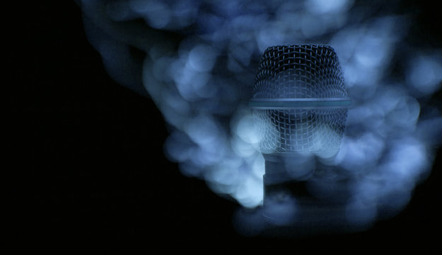 Microphone on dark background.