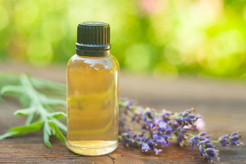 lavender essential oil in  beautiful bottle on table