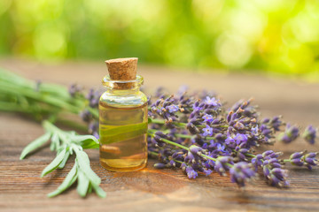 lavender essential oil in  beautiful bottle on table