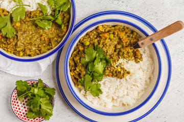 Lentil curry with rice, Indian cuisine, tarka dal, white background, top view. Vegan food. - obrazy, fototapety, plakaty
