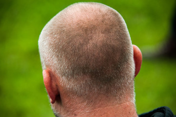 man with grey thin short hair