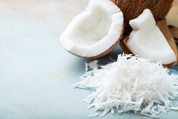 Coconut flakes on a blue background. with copy space