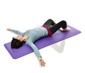 Mother woman exercising doing postnatal workout. Female fitness stretching hands and legs in gym...