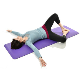 Mother woman exercising doing postnatal workout. Female fitness stretching hands and legs in gym...